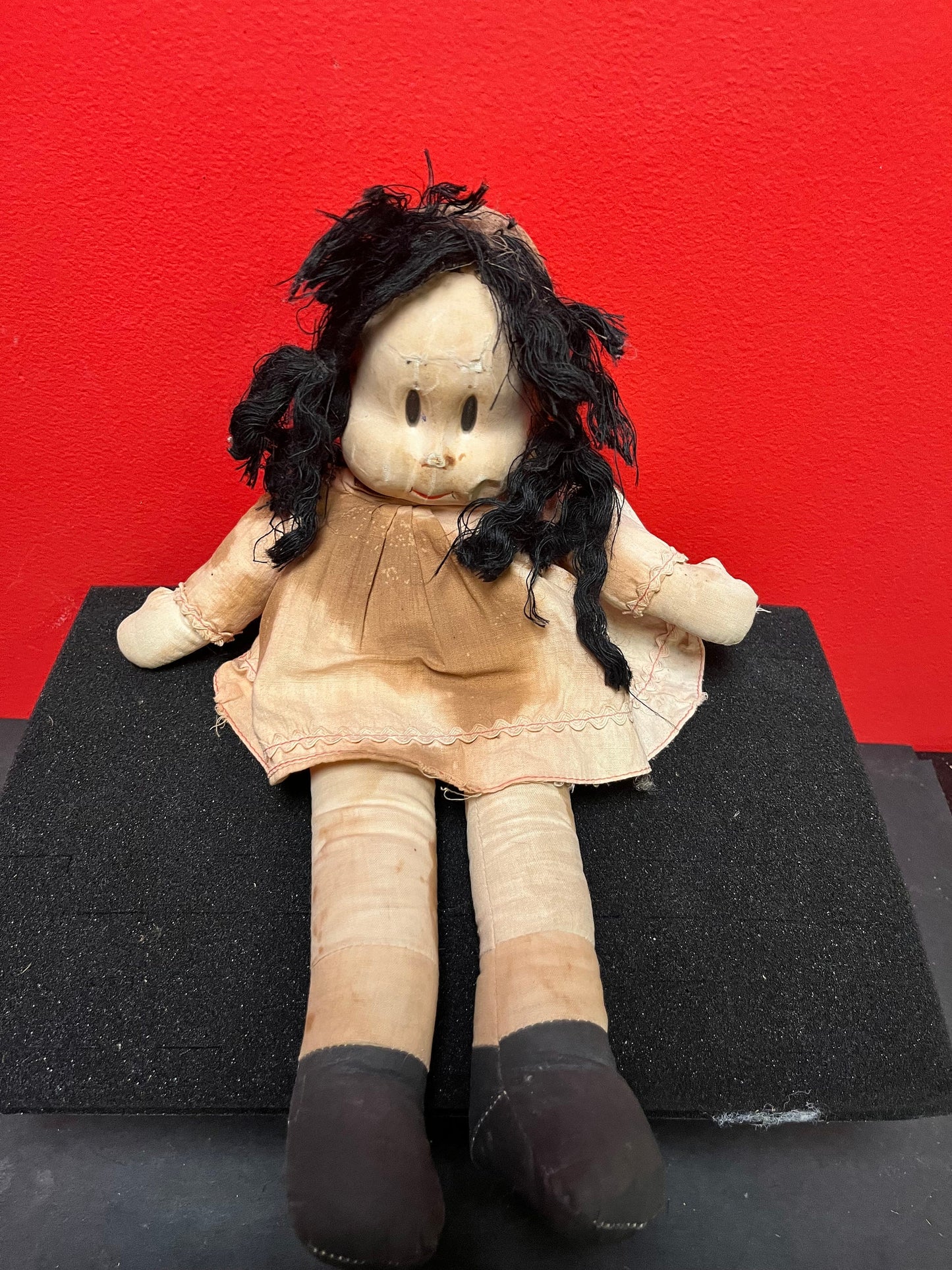 An  Antique 15 inch high Lulu doll in bad condition