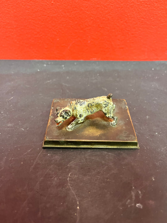 3 inch antique cold, painted bronze dog on stand with registration number  good condition and great patina