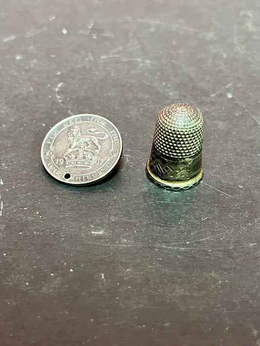 Sterling silver 1921 shilling silver brooch and a silver thimble