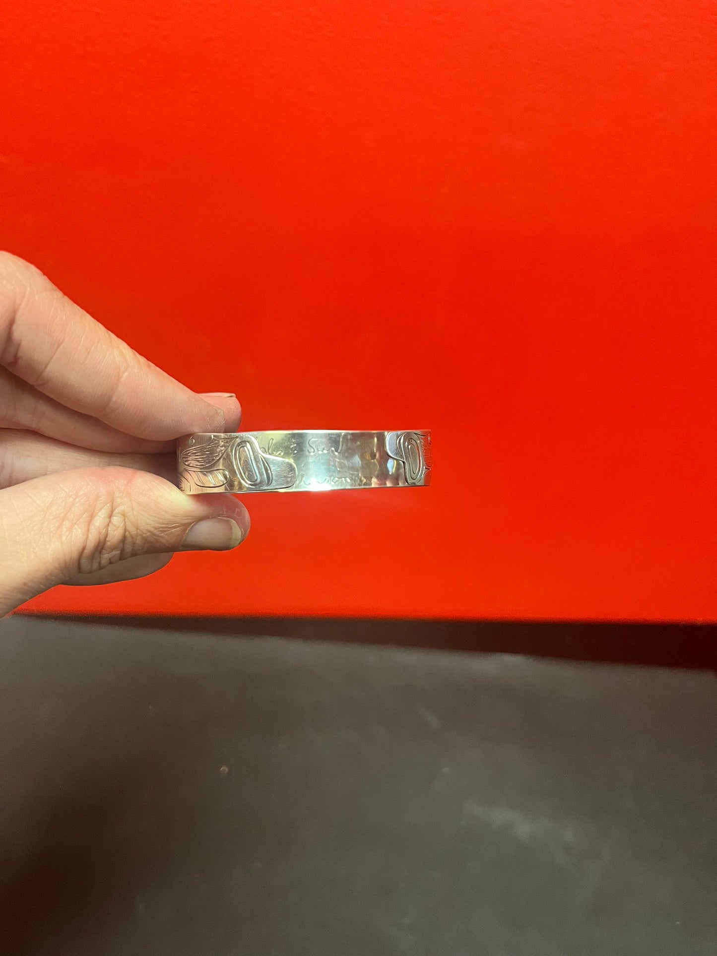 Lovely 2 1/2 inch wide heavy signed whale and sun indigenous first nations Pacific Northwest Coast Sterling bracelet bangle