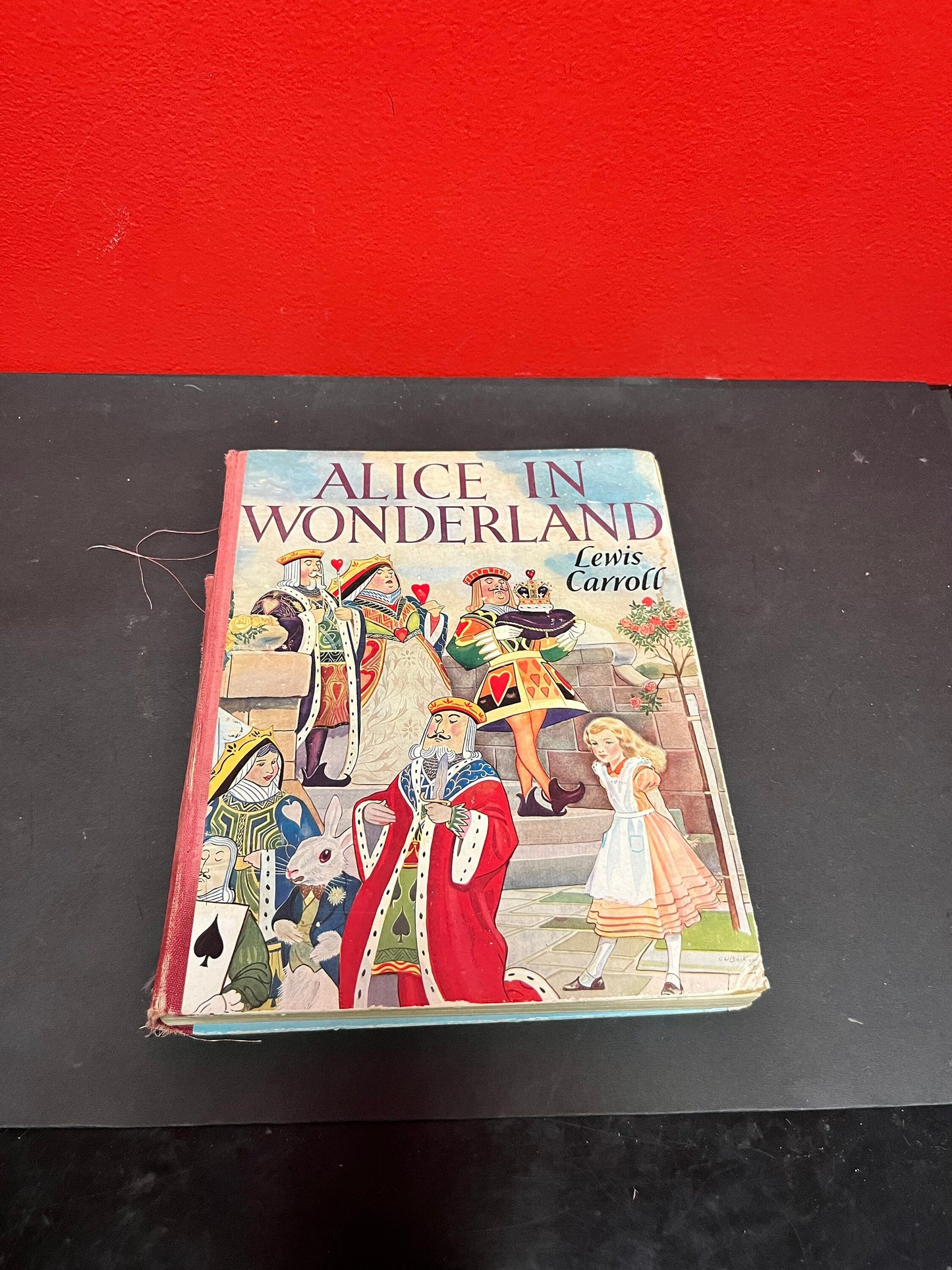 Antique 10 x 8 Alice in Wonderland book by Lewis Carroll  as is  see photos