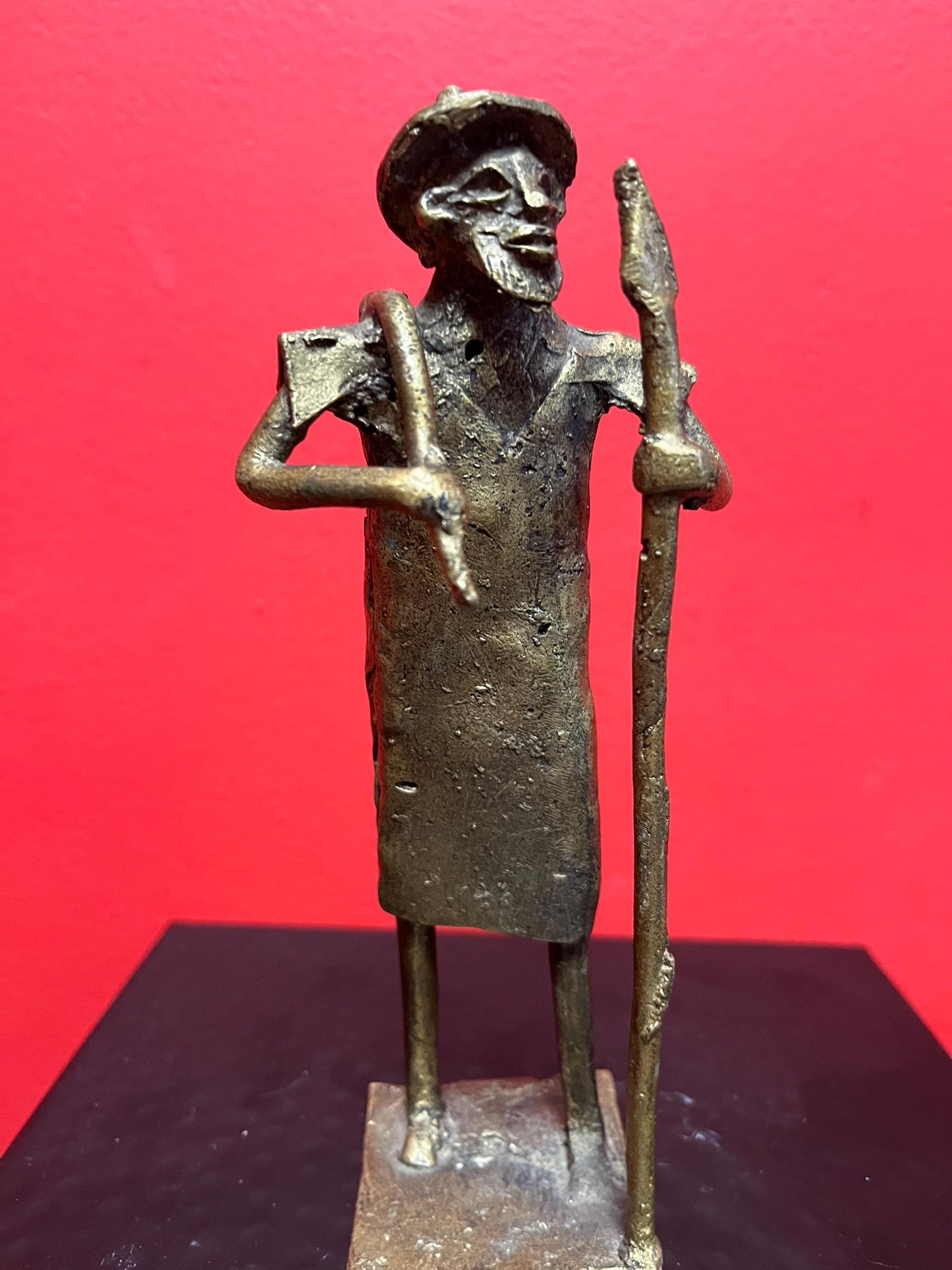 Lovely 7 inch tall African bronze  Benin statue of a farmer -