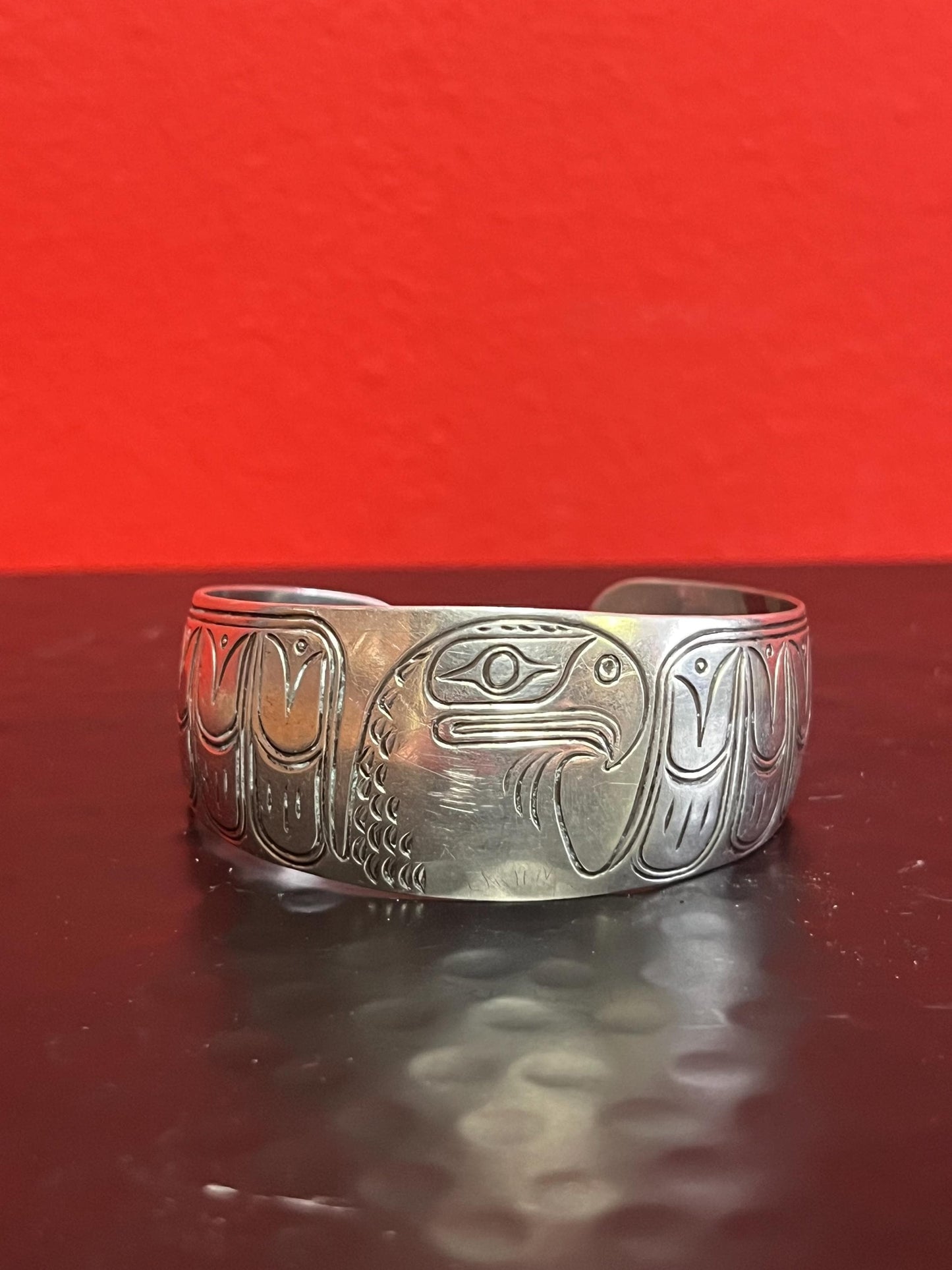 Lovely 2 inch  wide indigenous first nations sterling silver eagle bracelet   great gift and signed  heavy weight  amazing definition -