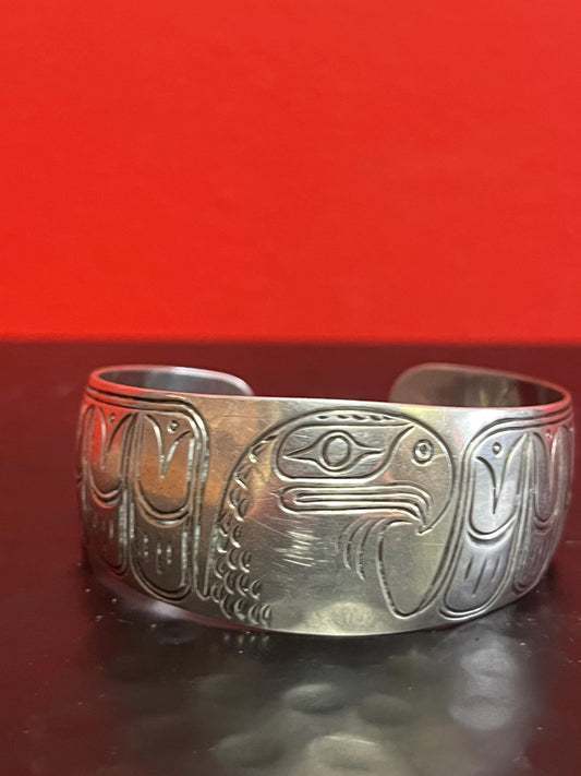 Lovely 2 inch  wide indigenous first nations sterling silver eagle bracelet   great gift and signed  heavy weight  amazing definition -