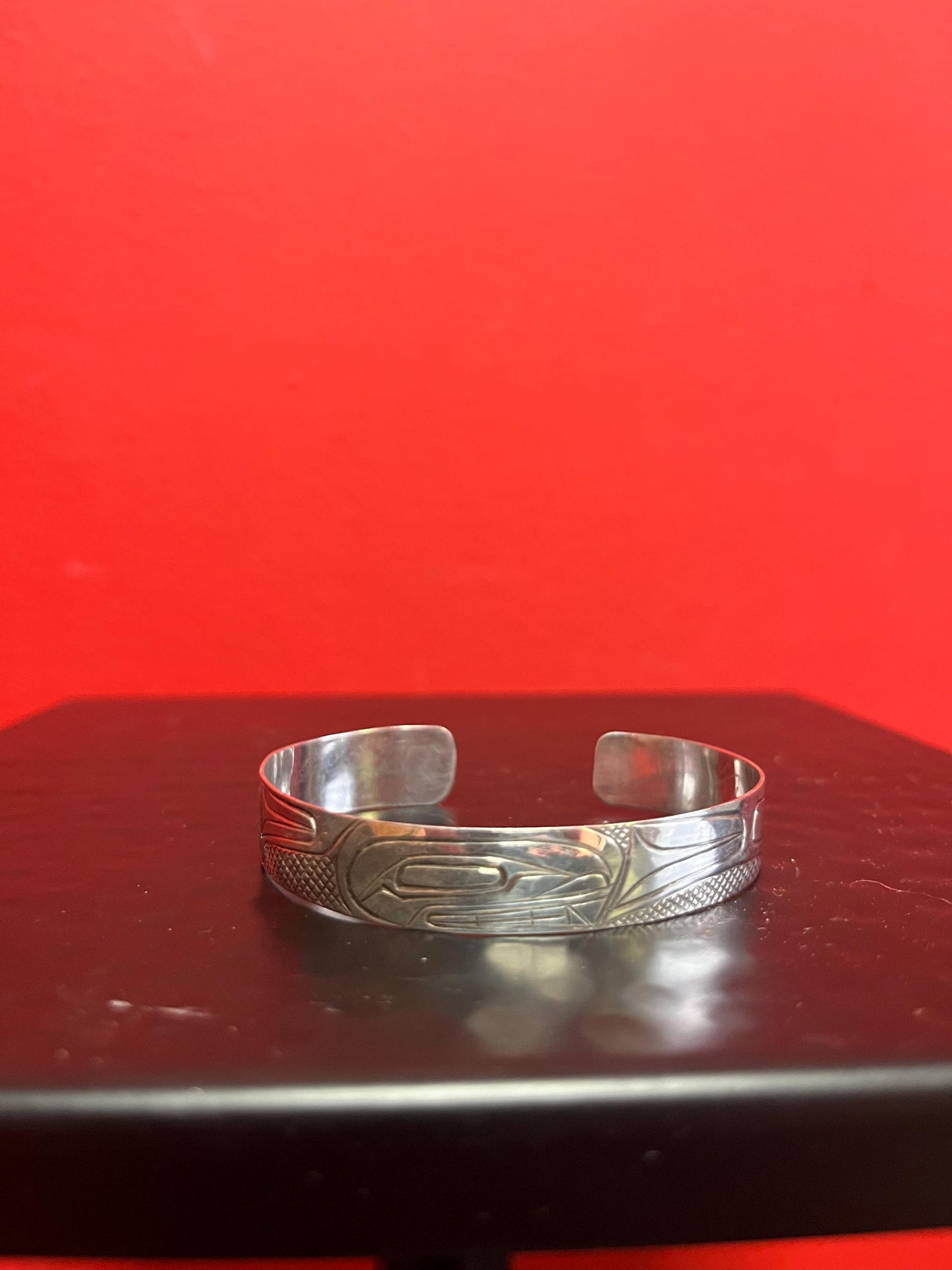 Lovely 2 1/2 inch wide indigenous first nations sterling silver raven  bracelet   great gift and signed  heavy weight