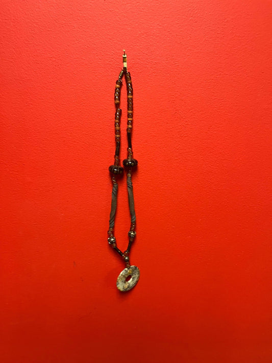 Approximately 26 inch long stone, beads and wood necklace  very funky and beautiful  great gift -