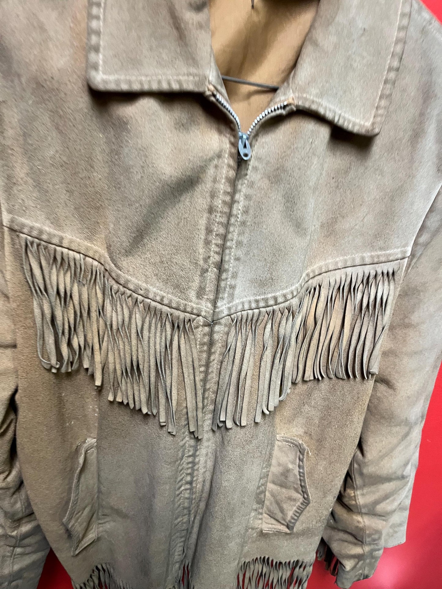 Vintage 33 inch long by 14 inch chest cowhide Cherokee style jacket with tassels  very cool and ready to wear