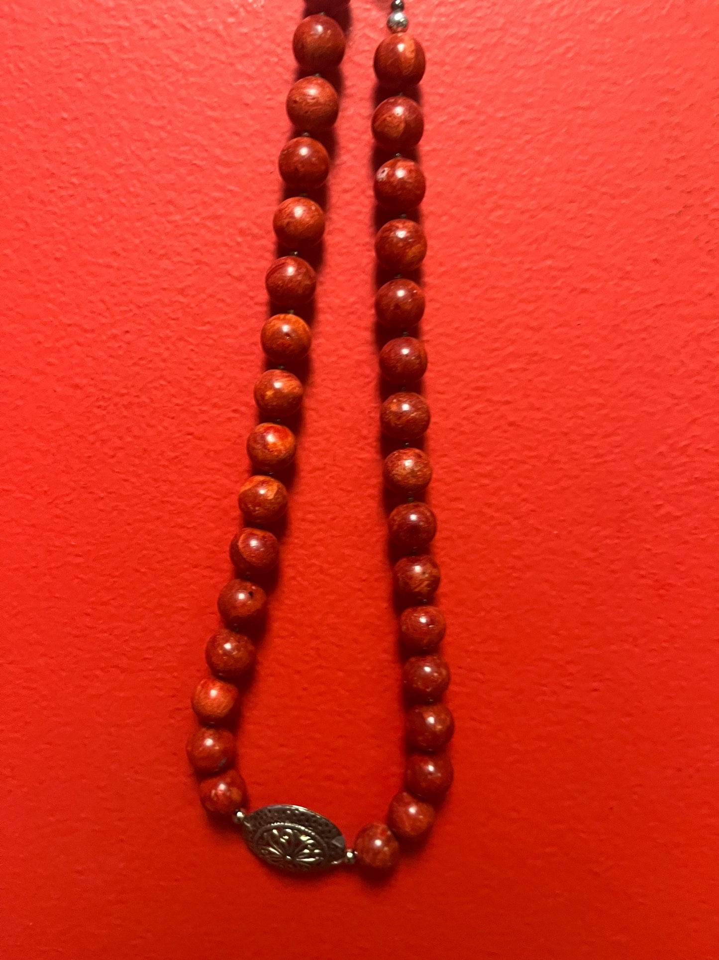 Beautiful approximately 20 inch long, red stone and silver plate pendant necklace  bright and beautiful