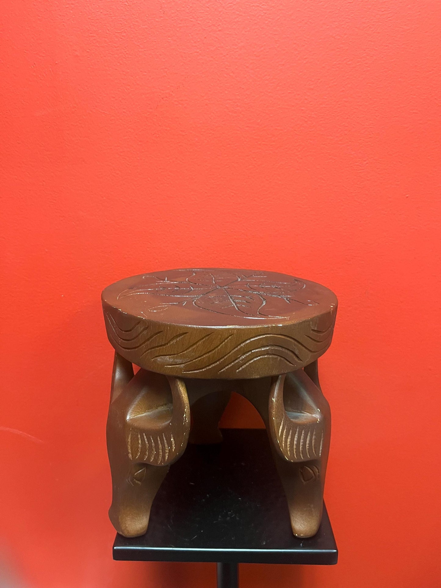 Very cool African 8 x 8 stool with legs the shape of yaks  great conversation piece and great value