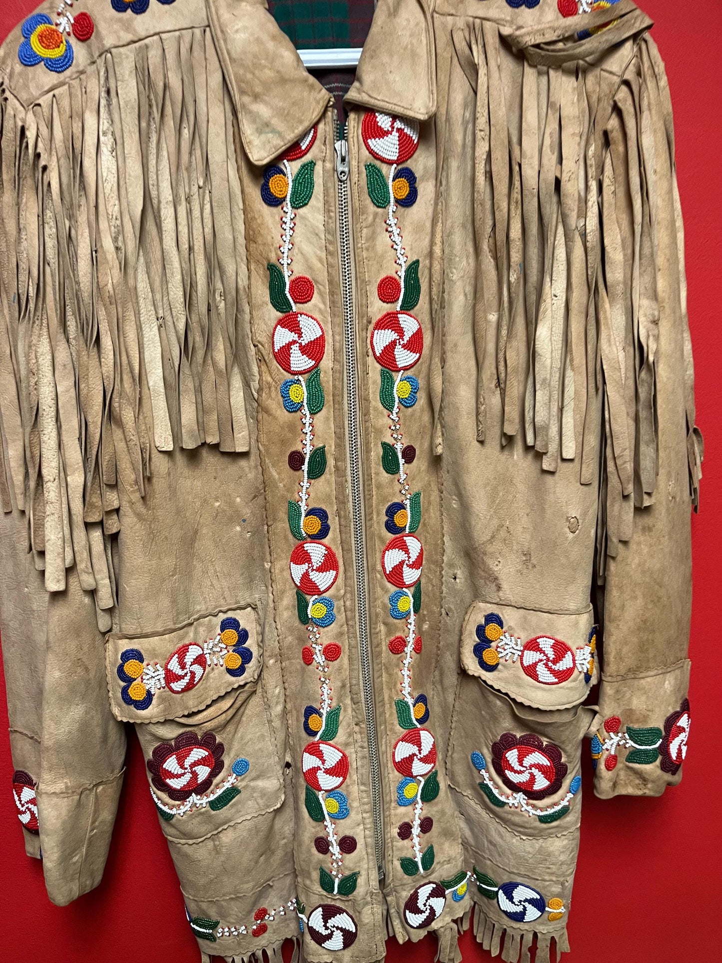 Stunning, indigenous native antique beaded jacket  approximately 32 inches long and 16 inch chest medium to large  minor damage see photo