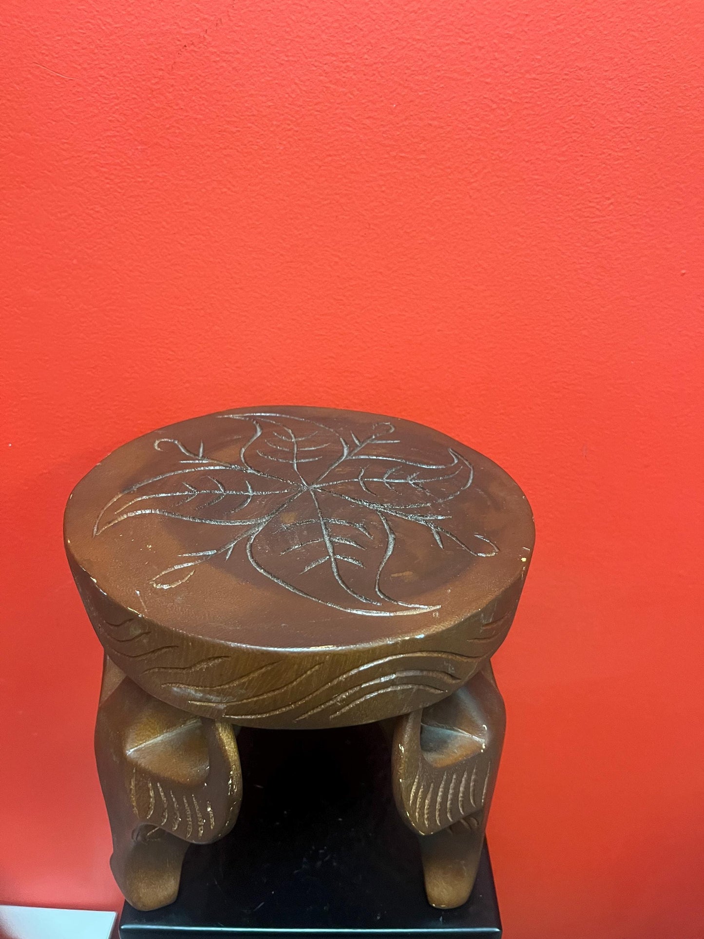 Very cool African 8 x 8 stool with legs the shape of yaks  great conversation piece and great value