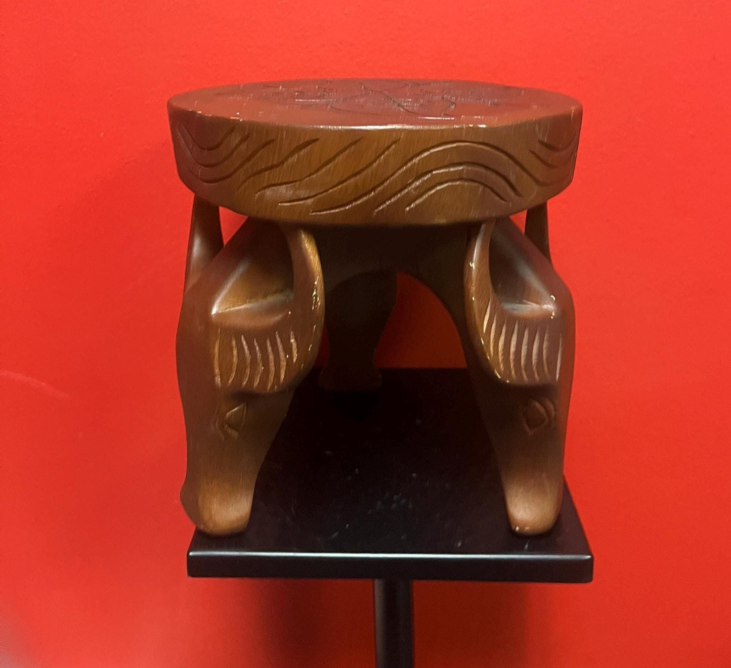 Very cool African 8 x 8 stool with legs the shape of yaks  great conversation piece and great value