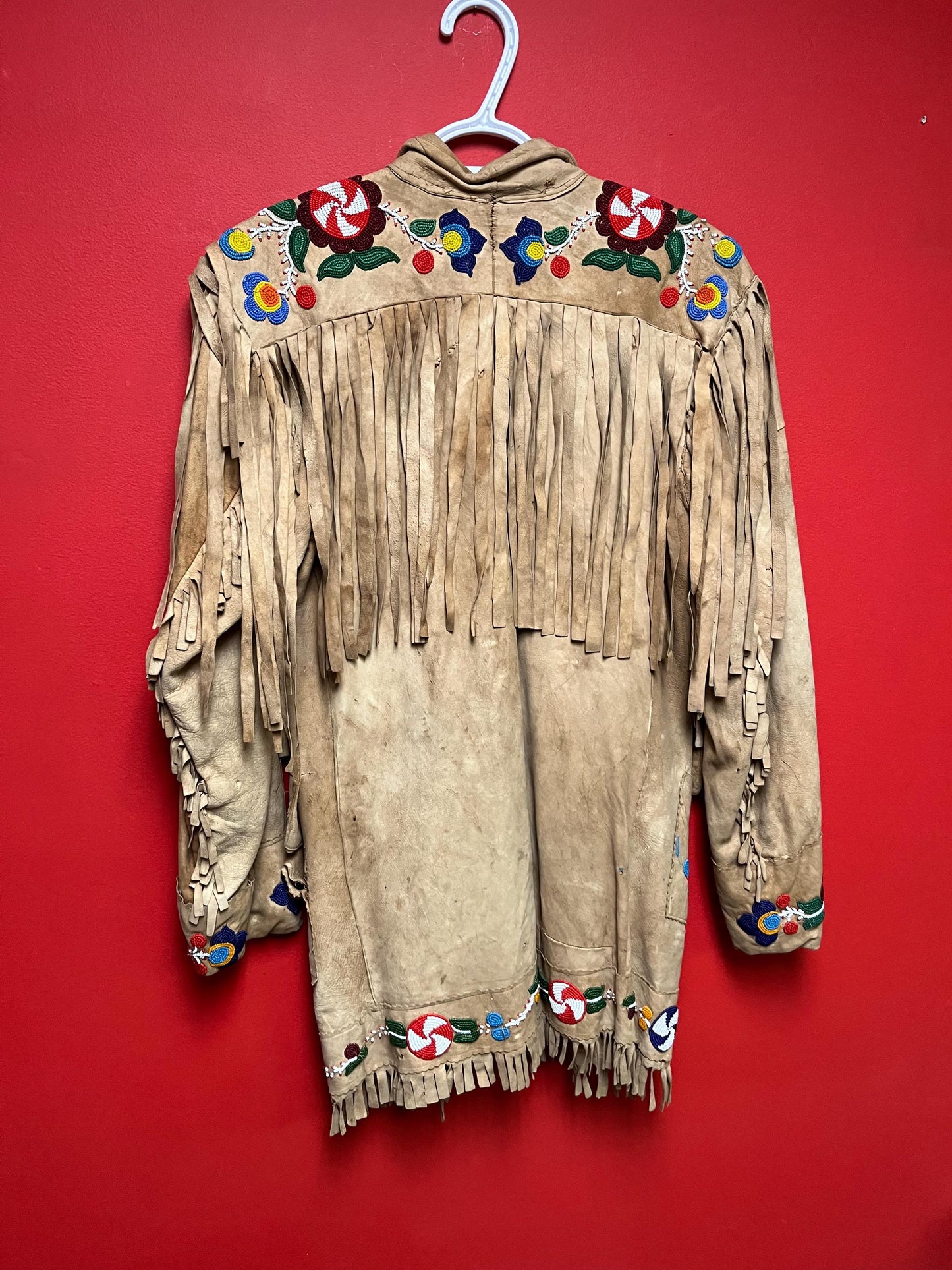 Stunning, indigenous native antique beaded jacket  approximately 32 inches long and 16 inch chest medium to large  minor damage see photo