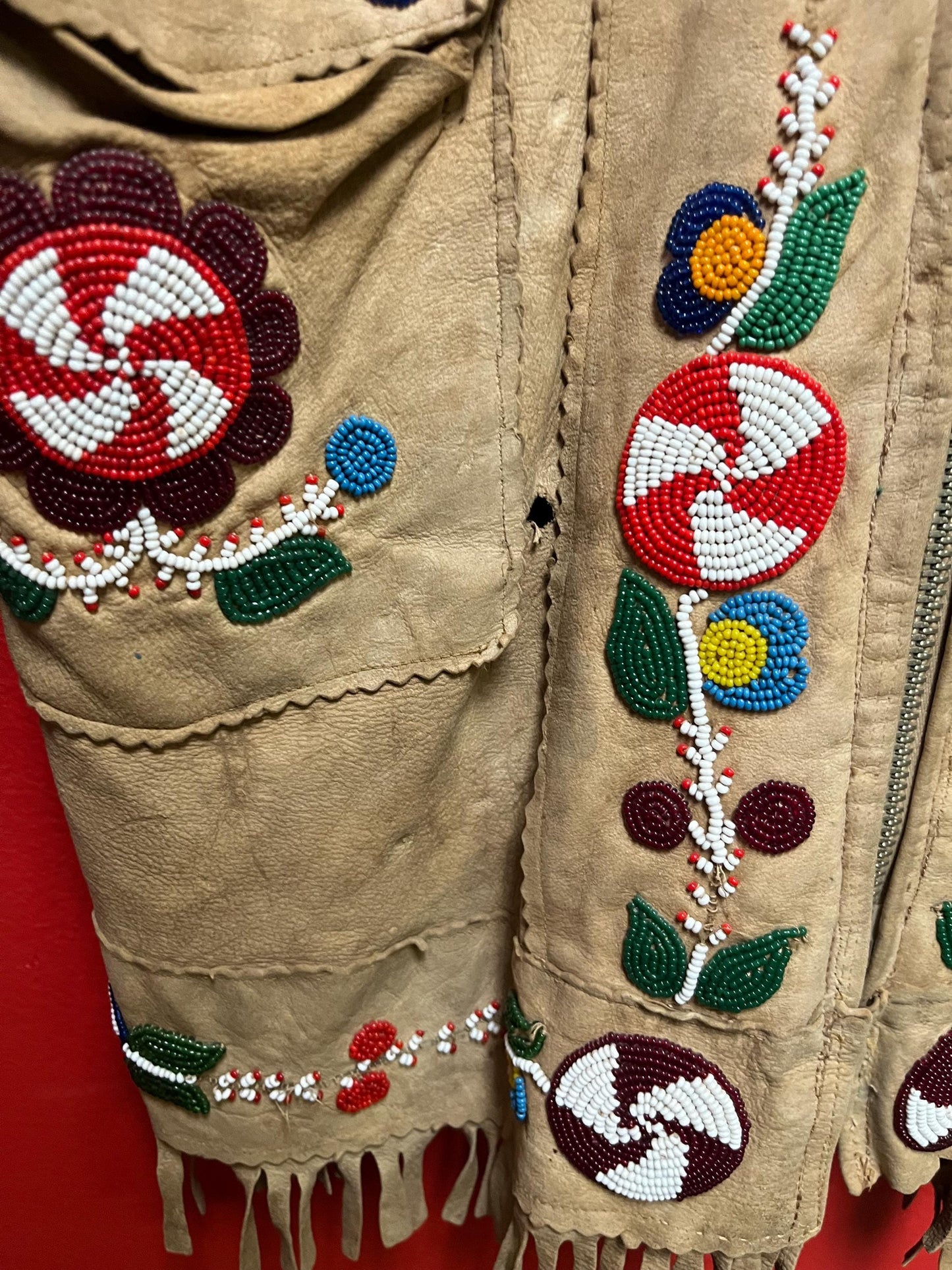 Stunning, indigenous native antique beaded jacket  approximately 32 inches long and 16 inch chest medium to large  minor damage see photo